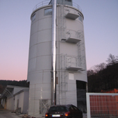 Boiler house at base of wood fuel silo